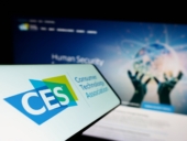 Smartphone with logo of trade organization Consumer Technology Association (CTA) on screen with website.